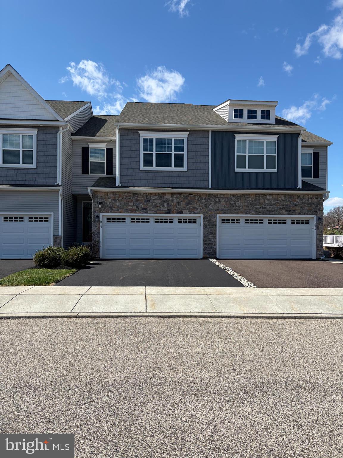 front view of a house with a street