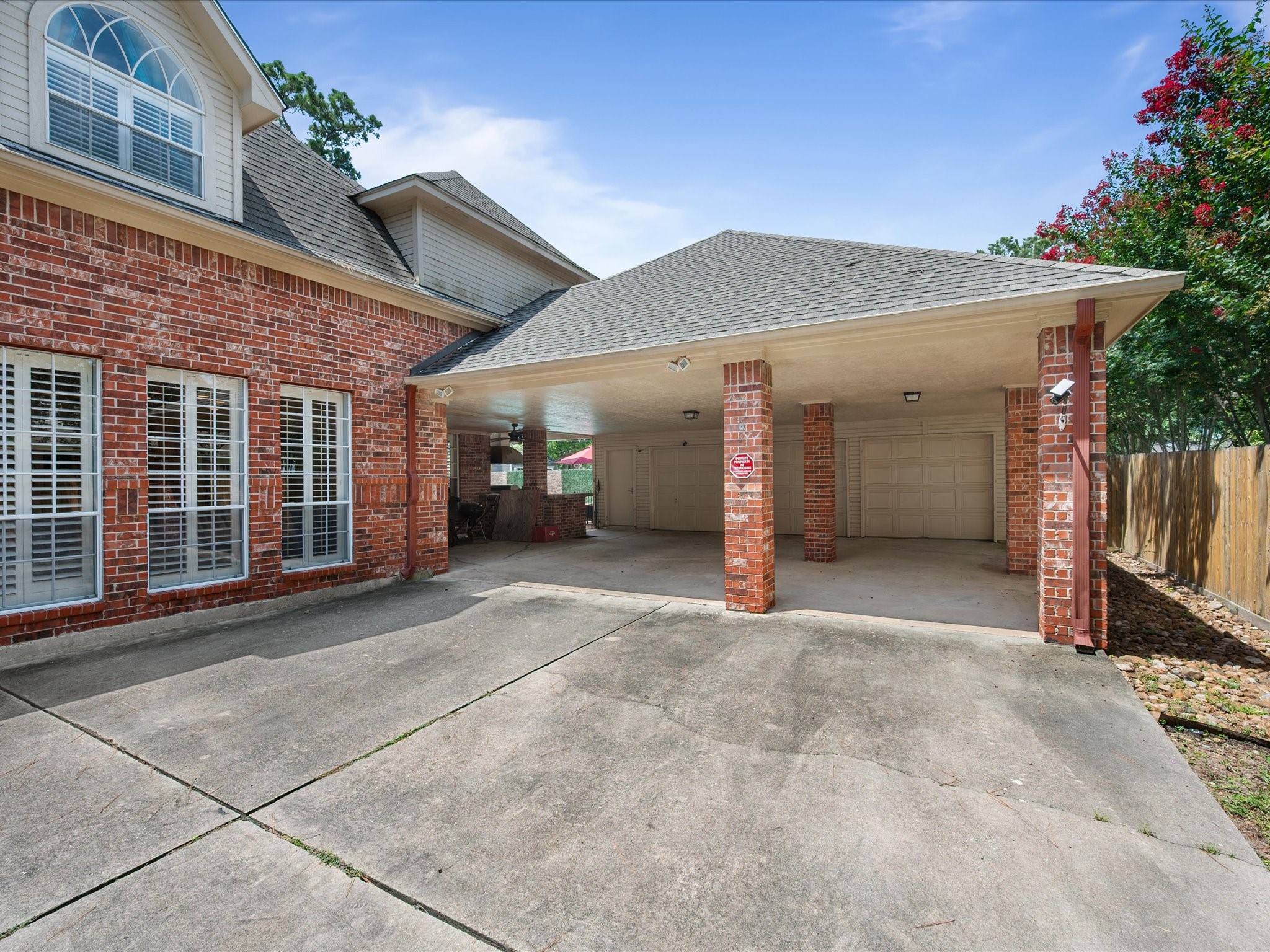 16123 Lafone Drive Spring, TX 77379 - Photo 6 of 47 In addition to the attached two-car garage, a covered carport extension provides added flexibility for vehicles, hobbies, or guest parking.