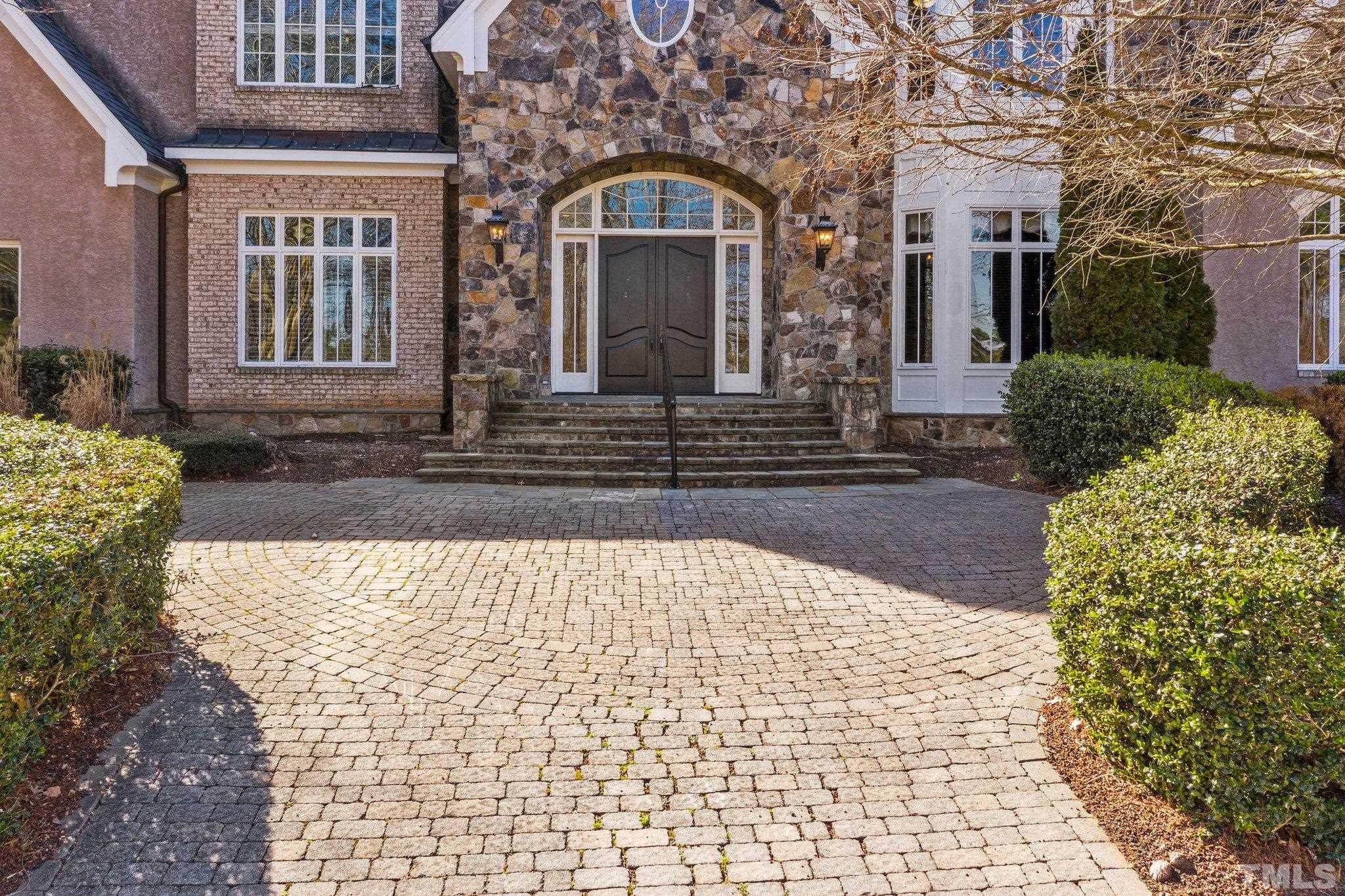 12501 Village Springs Road Raleigh, NC 27614 - Photo 12 of 93 a view of a brick house with large windows