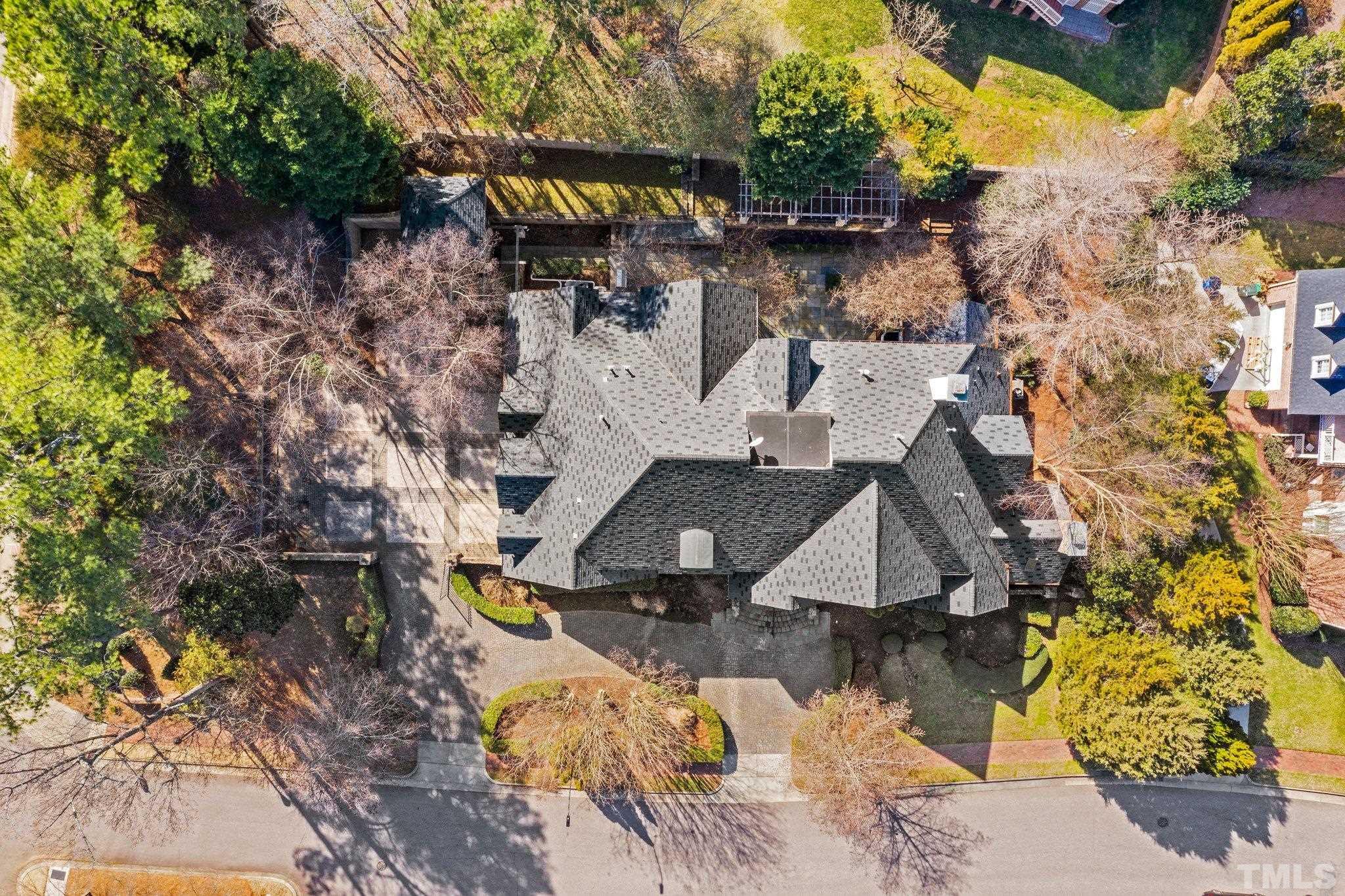 12501 Village Springs Road Raleigh, NC 27614 - Photo 17 of 93 a aerial view of a house with swimming pool and large trees