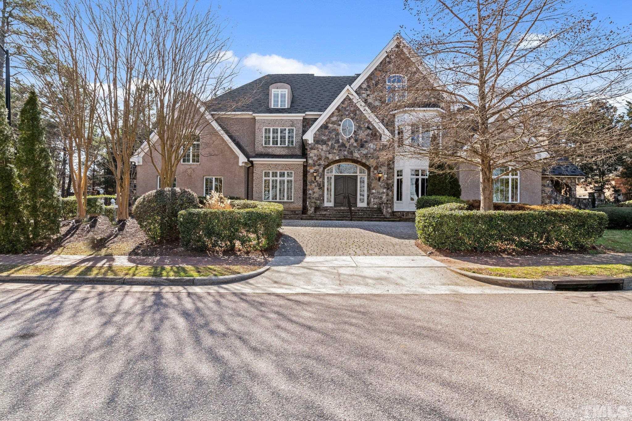 12501 Village Springs Road Raleigh, NC 27614 - Photo 22 of 93 a front view of a house with a yard