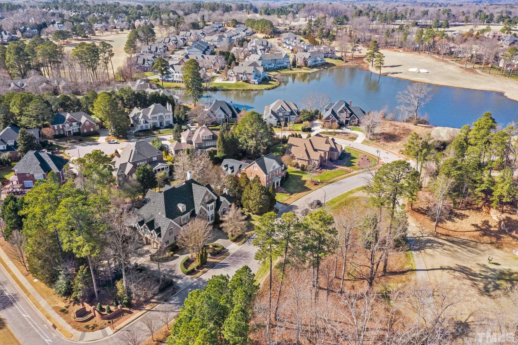 12501 Village Springs Road Raleigh, NC 27614 - Photo 41 of 93 an aerial view of a houses with a lake view