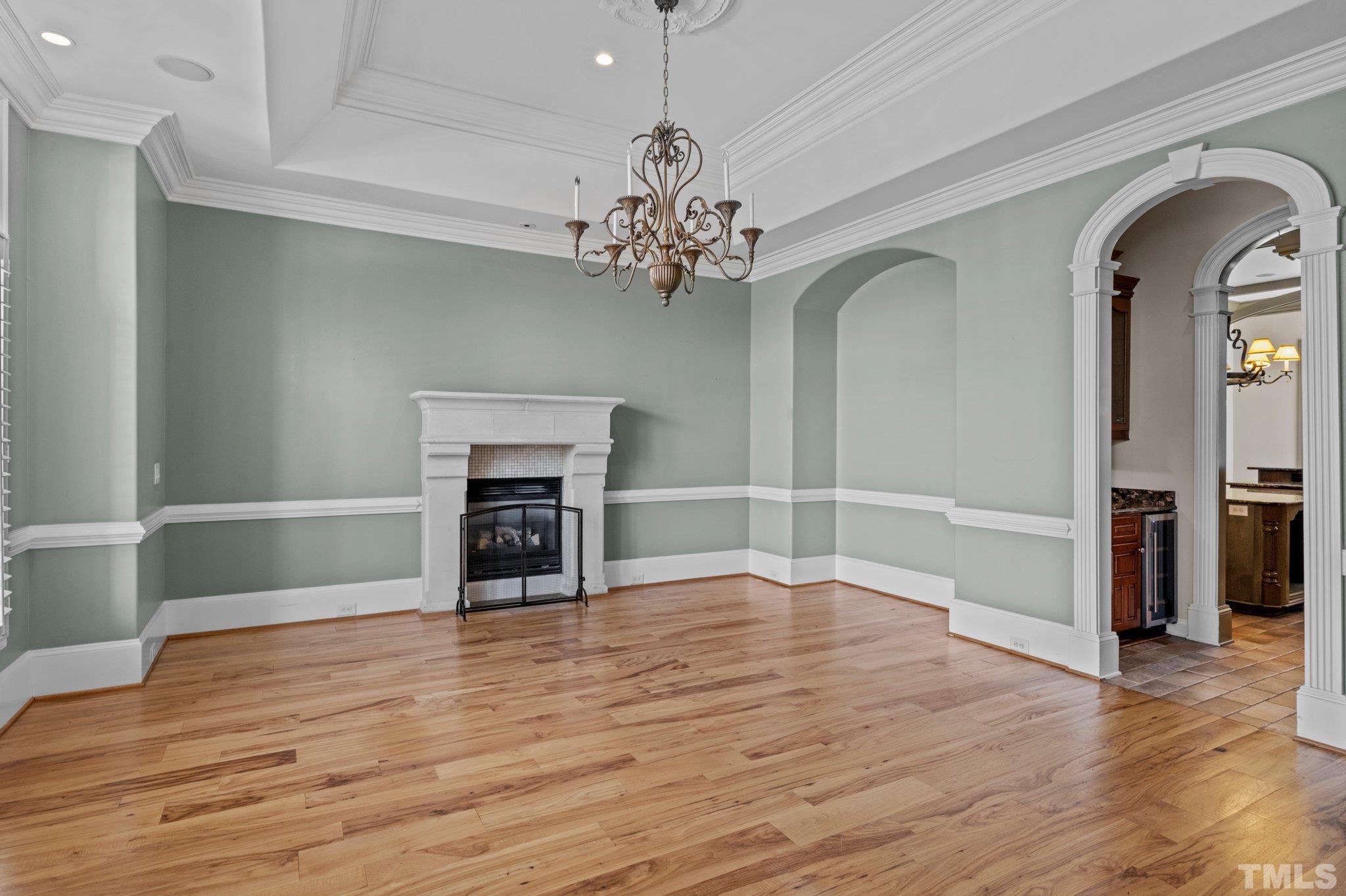 12501 Village Springs Road Raleigh, NC 27614 - Photo 5 of 93 a view of a room with wooden floor and fireplace