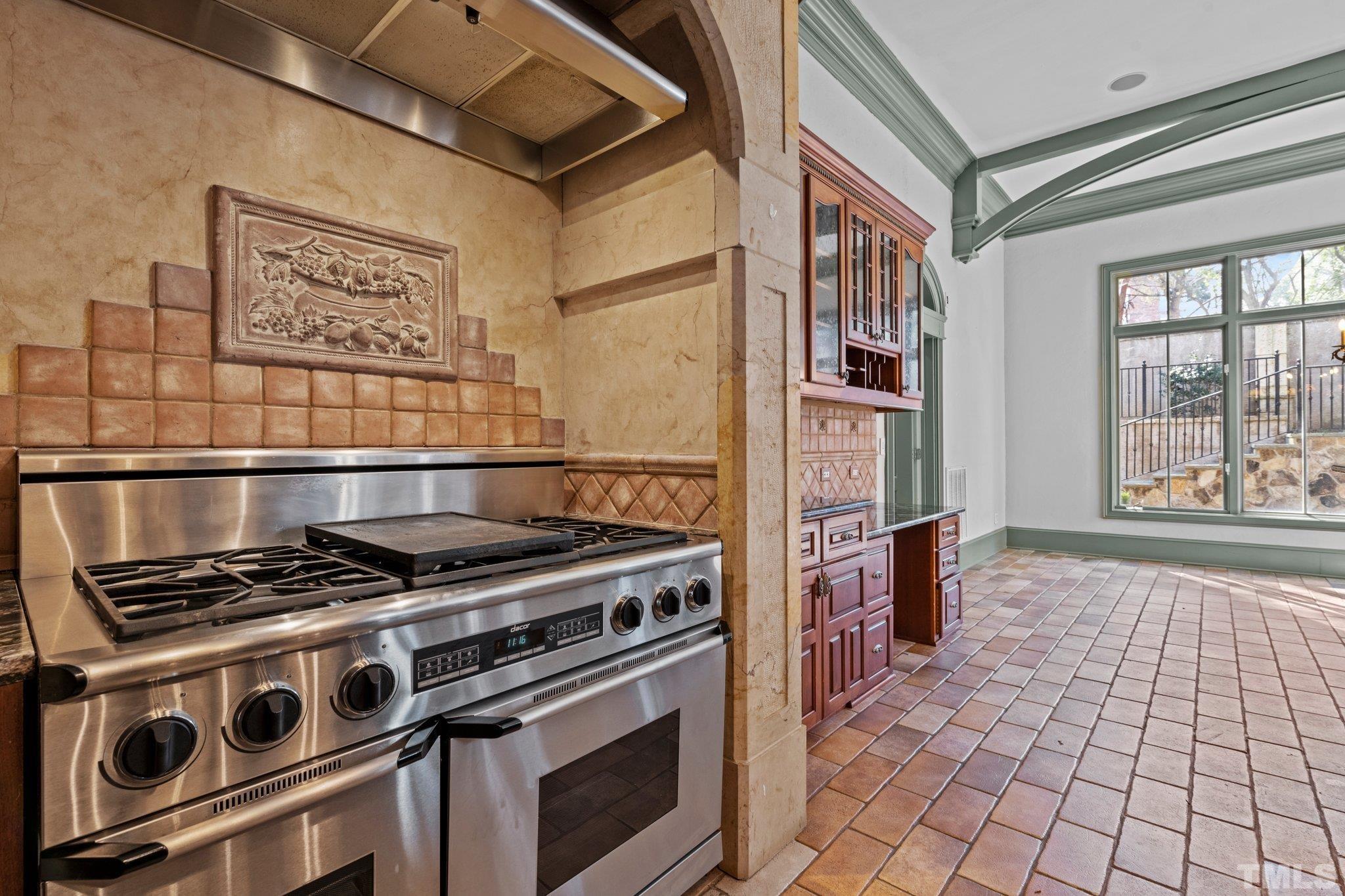 12501 Village Springs Road Raleigh, NC 27614 - Photo 51 of 93 a stove top oven sitting inside of a kitchen