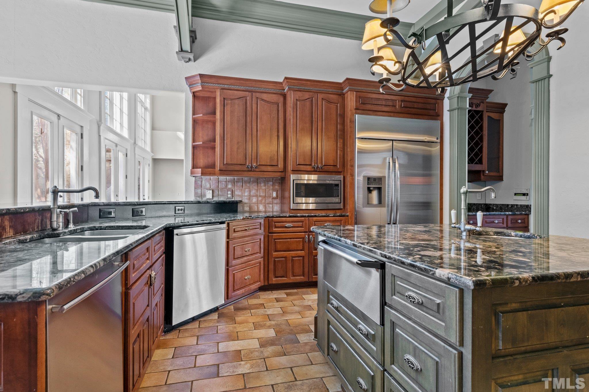 12501 Village Springs Road Raleigh, NC 27614 - Photo 52 of 93 a kitchen with stainless steel appliances granite countertop a sink stove and cabinets
