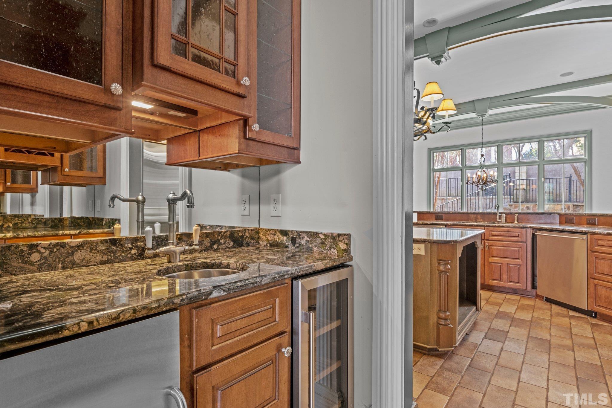 12501 Village Springs Road Raleigh, NC 27614 - Photo 53 of 93 a kitchen with stainless steel appliances granite countertop a sink and cabinets