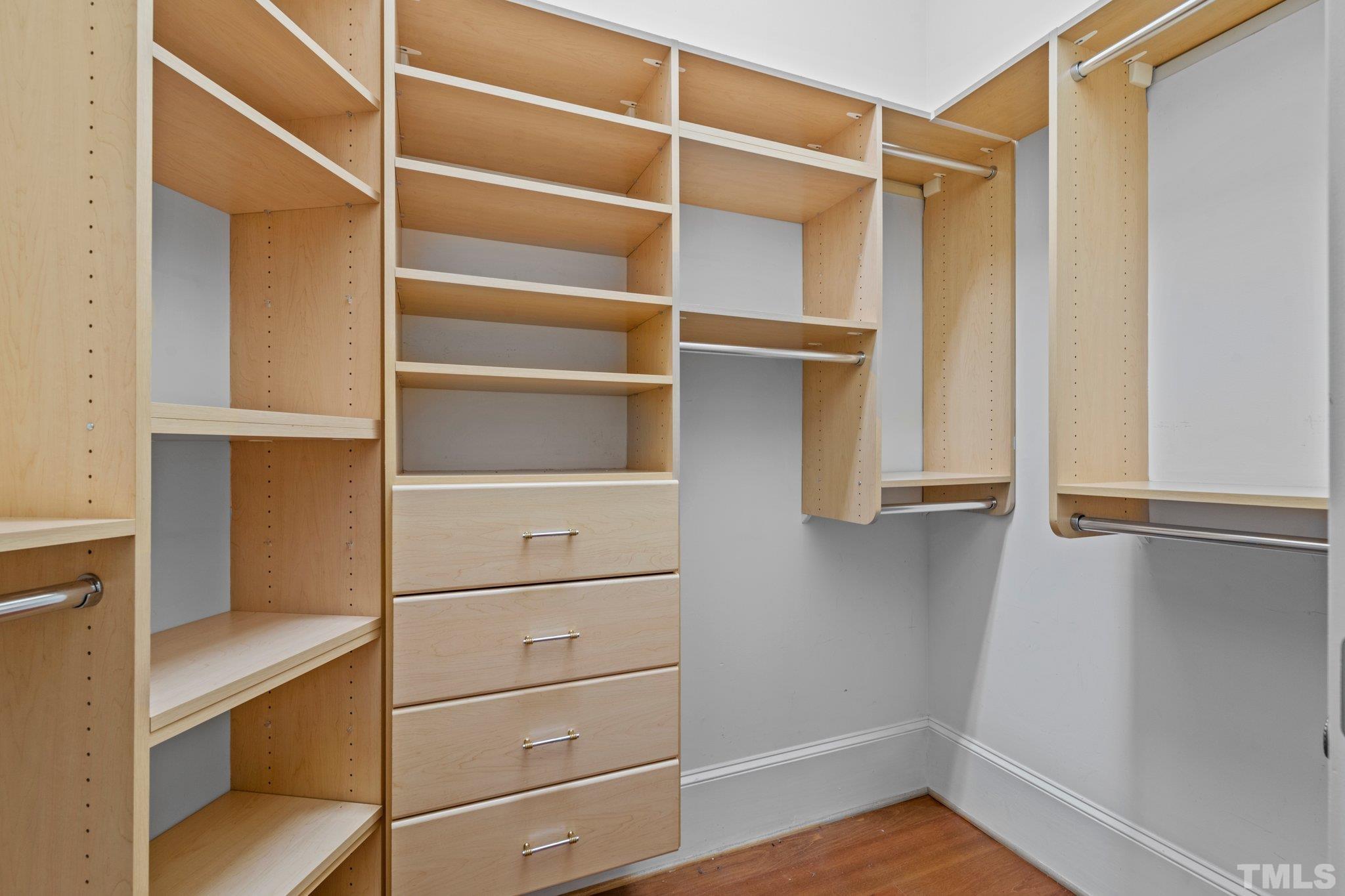 12501 Village Springs Road Raleigh, NC 27614 - Photo 63 of 93 a view of walk in closet with empty racks