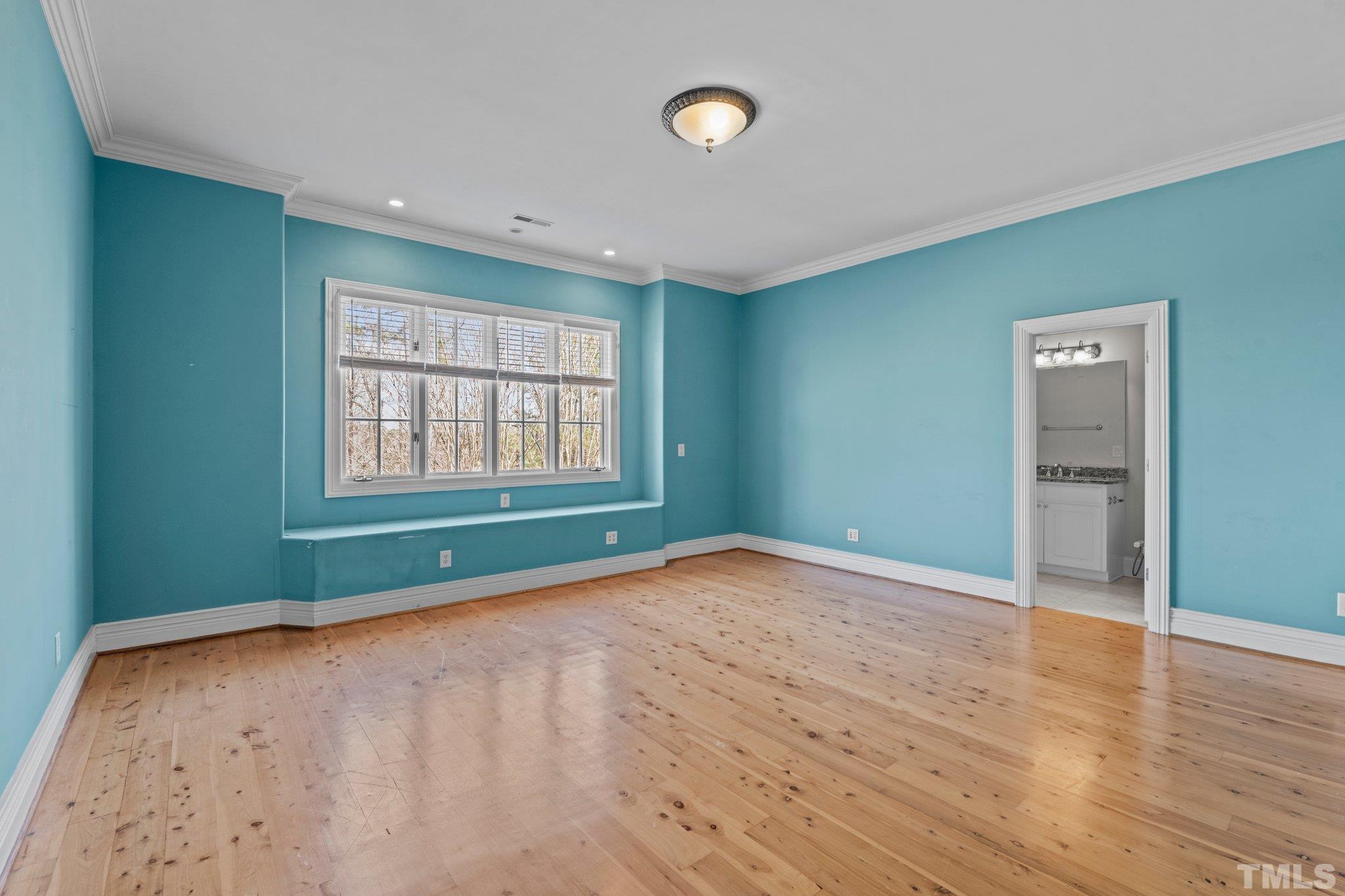 12501 Village Springs Road Raleigh, NC 27614 - Photo 72 of 93 an empty room with wooden floor and windows