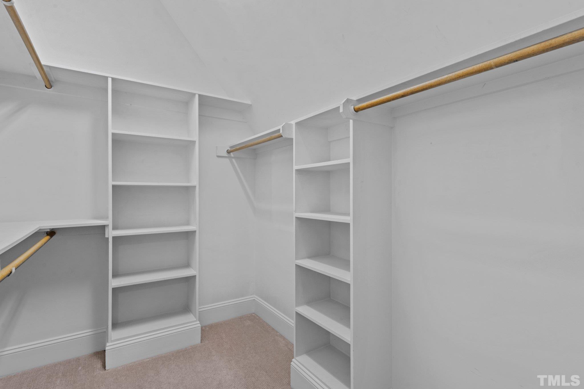 12501 Village Springs Road Raleigh, NC 27614 - Photo 82 of 93 a view of walk in closet with empty racks