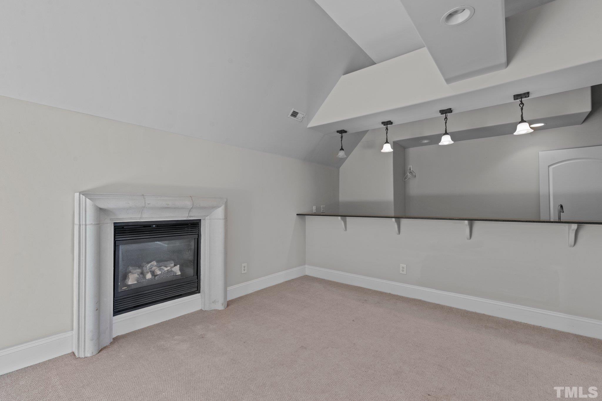 12501 Village Springs Road Raleigh, NC 27614 - Photo 87 of 93 a view of an empty room with a fireplace and a fireplace