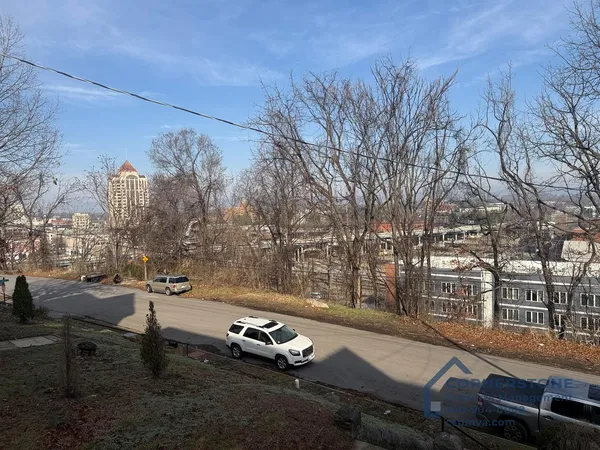 a view of a street with sitting area