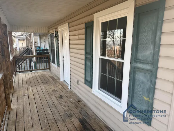 a view of outdoor space with wooden floor and fireplace