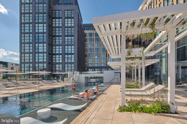 a view of swimming pool with outdoor seating