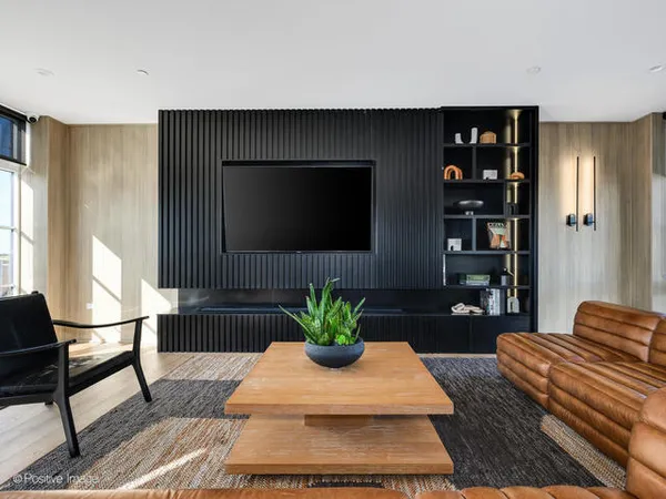 a room with furniture pool table and windows