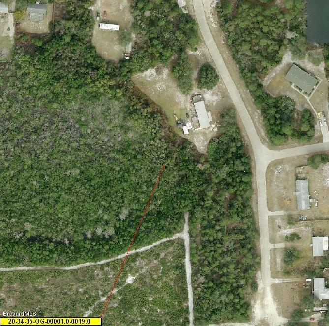 4130 Hog Valley Road Mims, FL 32754 - Photo 5 of 8 an aerial view of a residential houses with yard