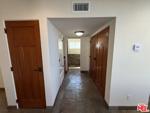 a bathroom with a glass door shower