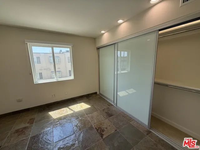 a view of a hallway with windows