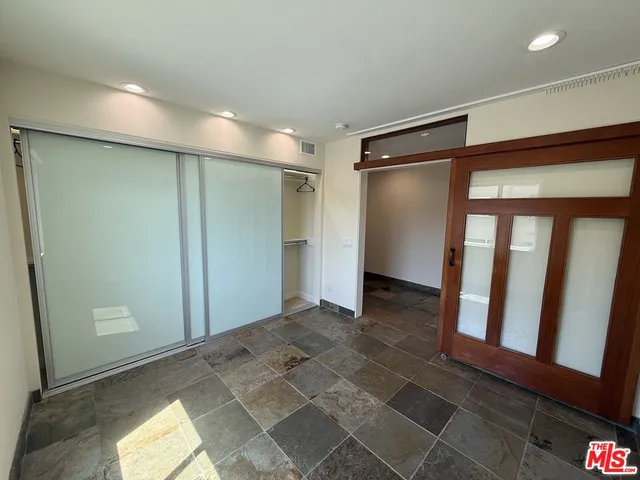 a bathroom with a bathtub a sink and a mirror