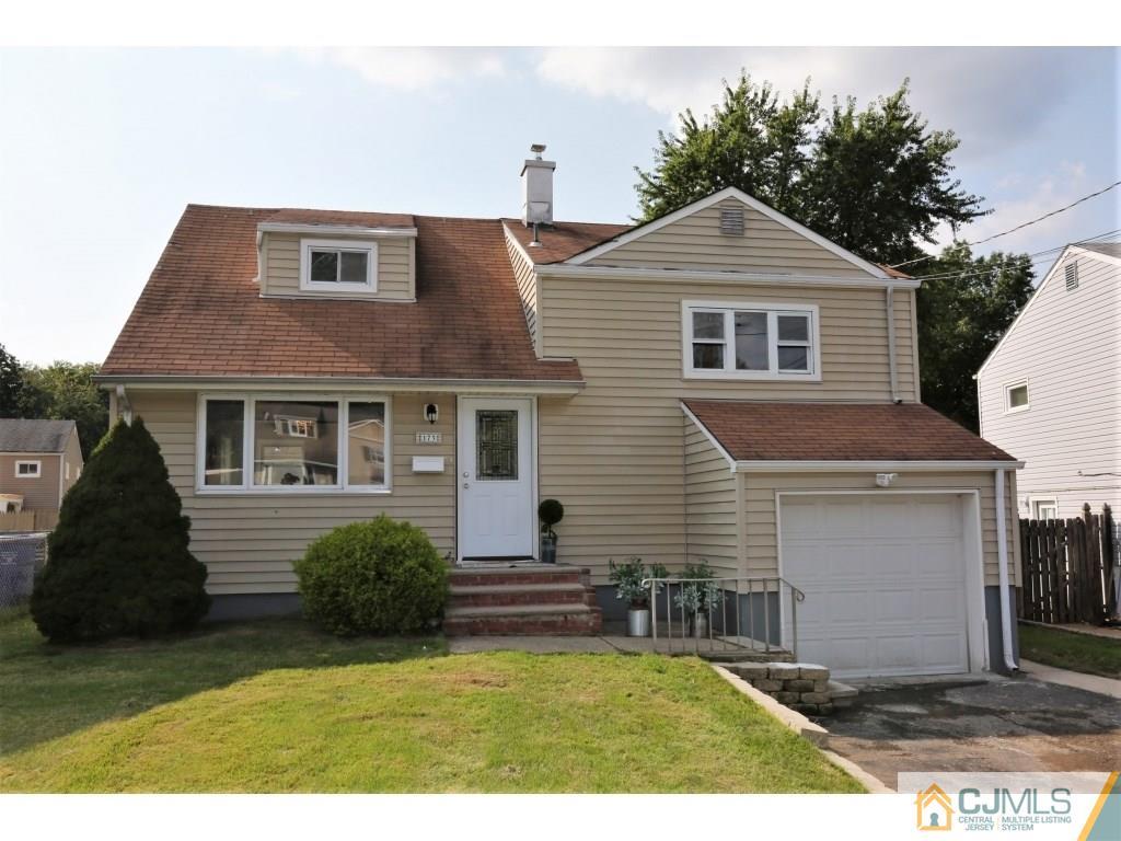 173 McFarlane Road Colonia, NJ 07067 - Photo 2 of 25 a front view of a house with a yard