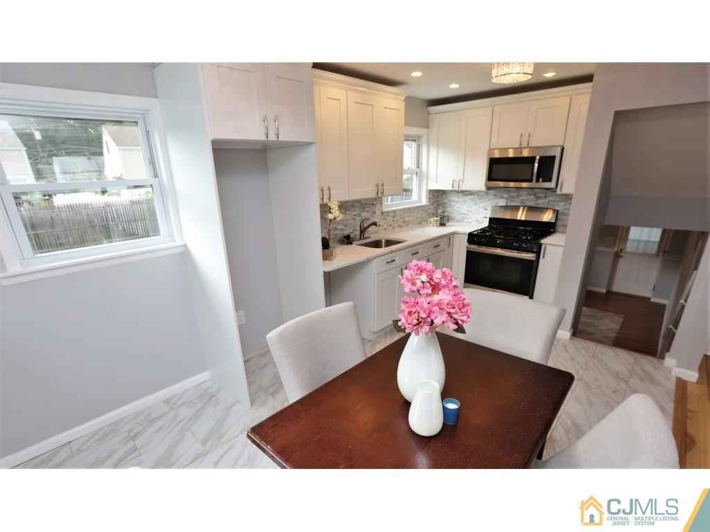 173 McFarlane Road Colonia, NJ 07067 - Photo 11 of 25 a kitchen with a sink appliances and cabinets