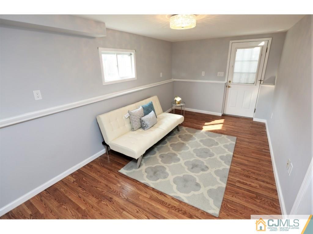 173 McFarlane Road Colonia, NJ 07067 - Photo 15 of 25 a view of a room with wooden floor and windows