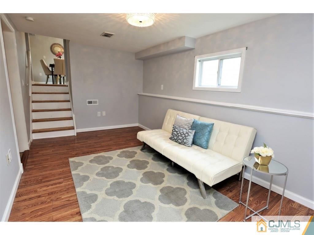 173 McFarlane Road Colonia, NJ 07067 - Photo 20 of 25 a living room with furniture and wooden floor