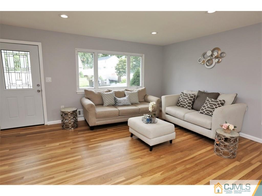 173 McFarlane Road Colonia, NJ 07067 - Photo 7 of 25 a living room with furniture and a large window