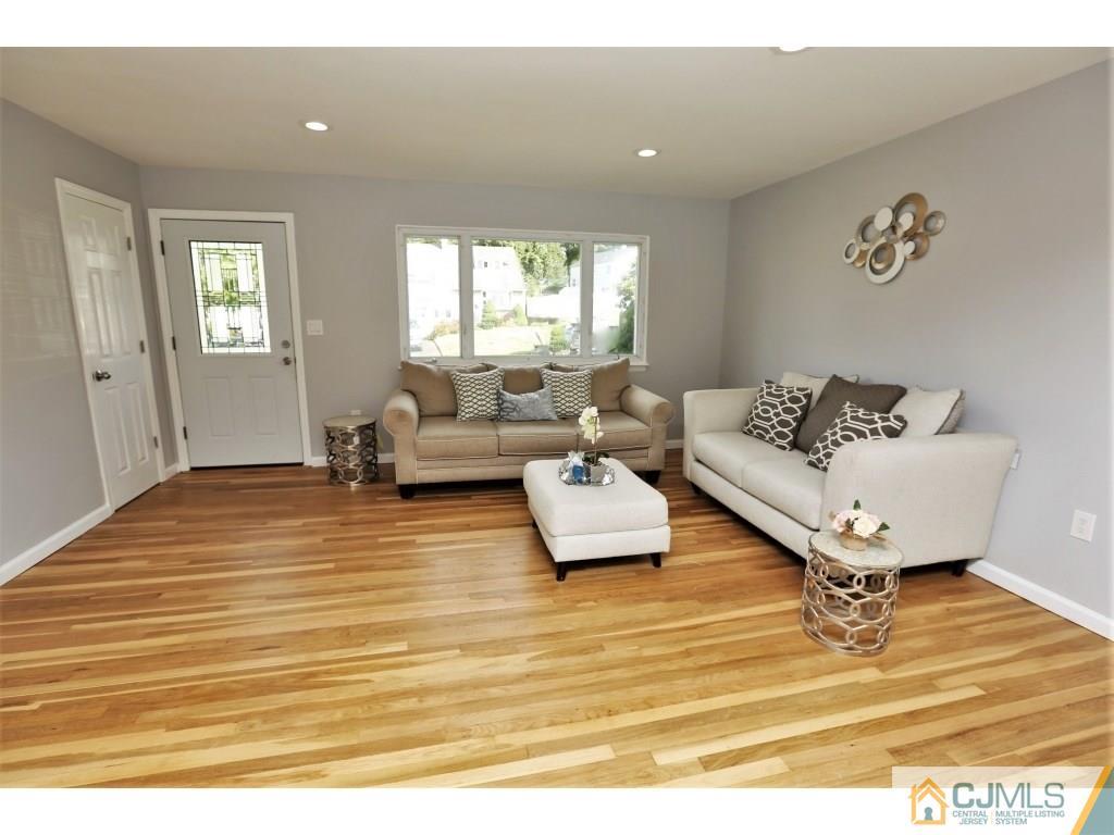 173 McFarlane Road Colonia, NJ 07067 - Photo 10 of 25 a living room with furniture and a window