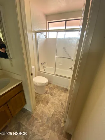 a bathroom with sink and mirror