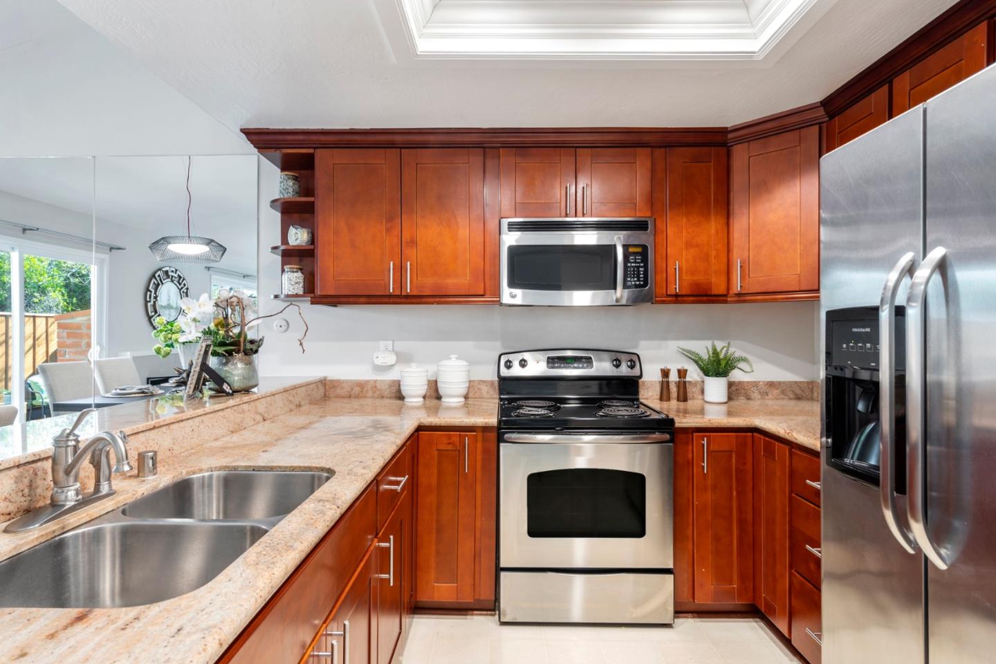 20173 Northcrest Square Cupertino, CA 95014 - Photo 13 of 29 a kitchen with granite countertop a sink stove and refrigerator