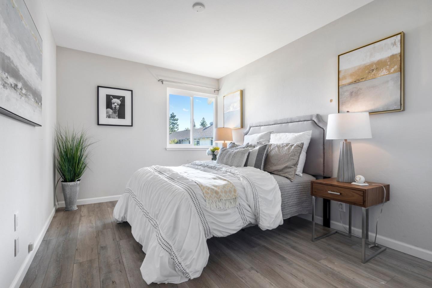 20173 Northcrest Square Cupertino, CA 95014 - Photo 14 of 29 a bedroom with bed and a potted plant