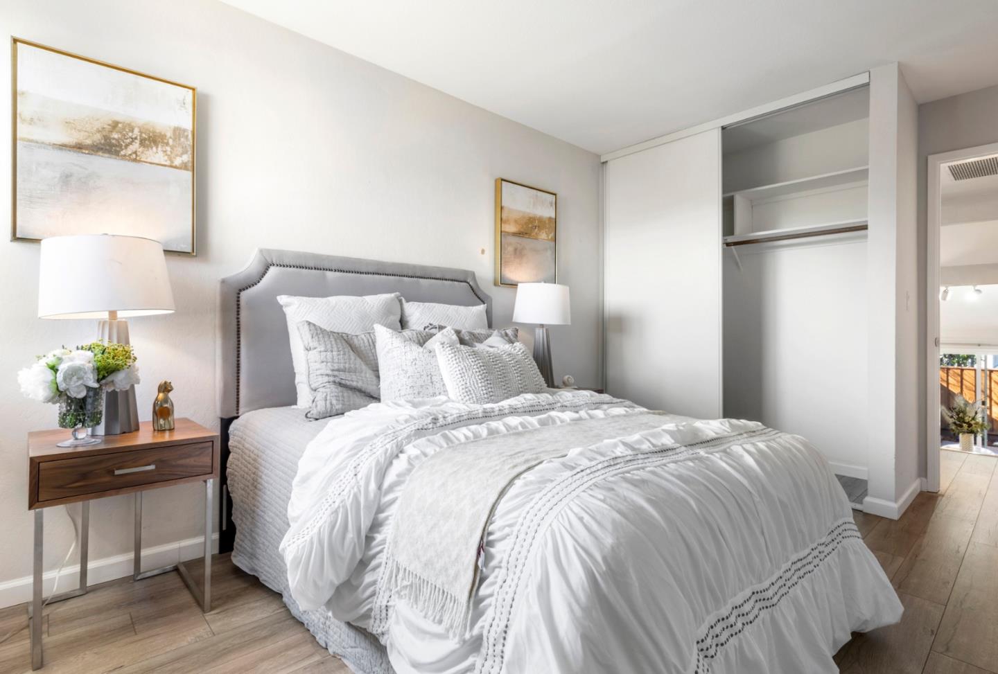 20173 Northcrest Square Cupertino, CA 95014 - Photo 15 of 29 a bedroom with a bed and painting on the wall