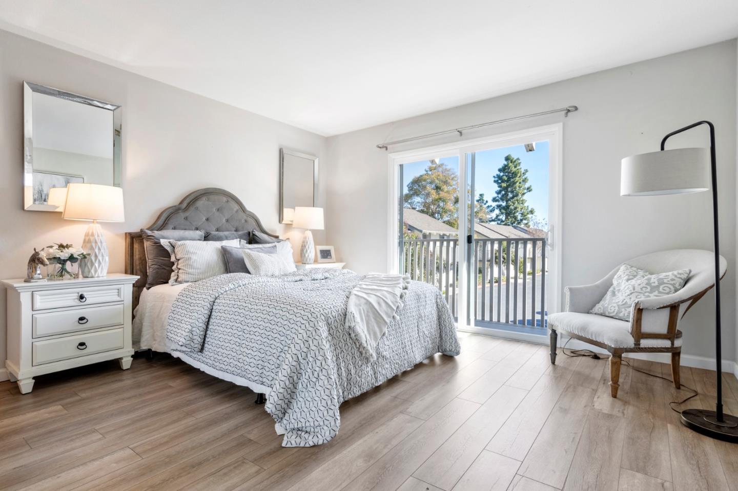 20173 Northcrest Square Cupertino, CA 95014 - Photo 17 of 29 a bedroom with a bed and a chair