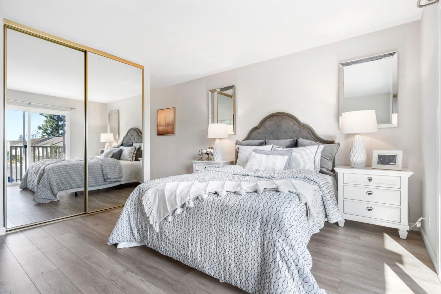 20173 Northcrest Square Cupertino, CA 95014 - Photo 18 of 29 a bedroom with a bed and a large window