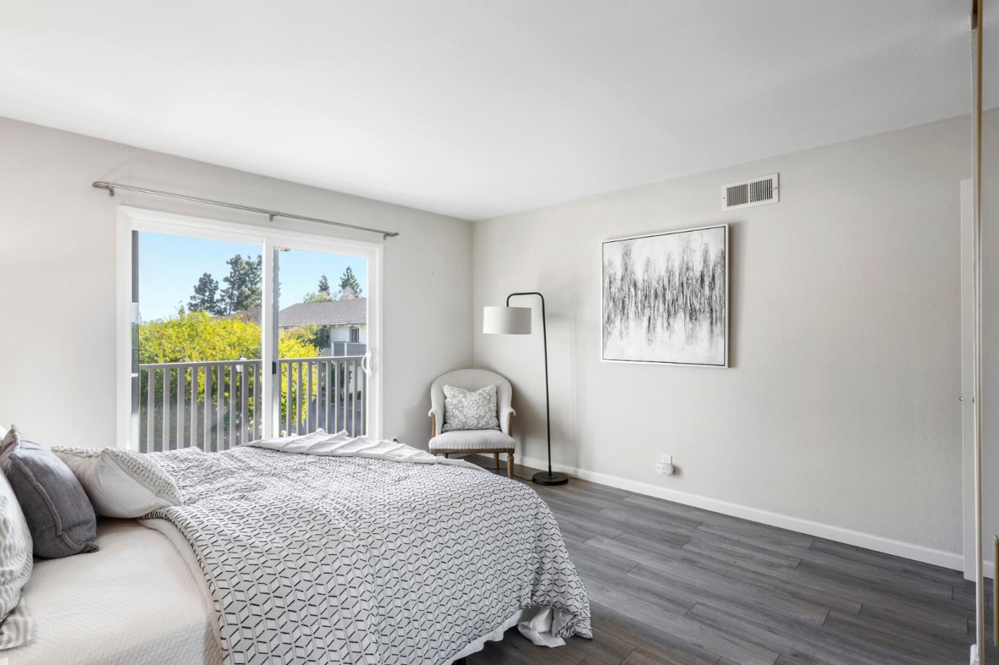 20173 Northcrest Square Cupertino, CA 95014 - Photo 20 of 29 a bedroom with a bed and a table