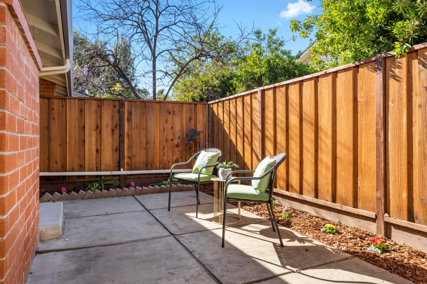 20173 Northcrest Square Cupertino, CA 95014 - Photo 22 of 29 a wooden bench sitting in front of a building