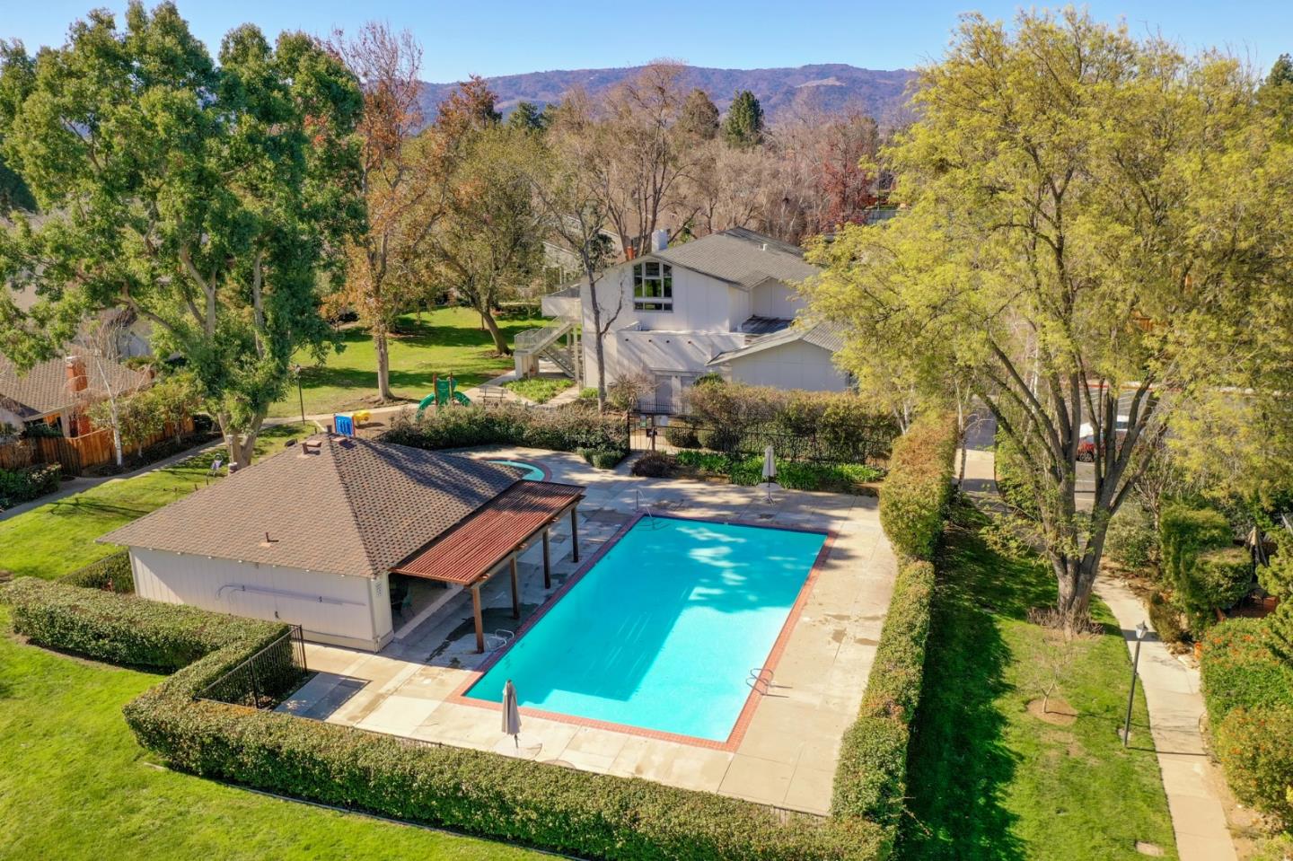 20173 Northcrest Square Cupertino, CA 95014 - Photo 25 of 29 an aerial view of a house with swimming pool and a yard