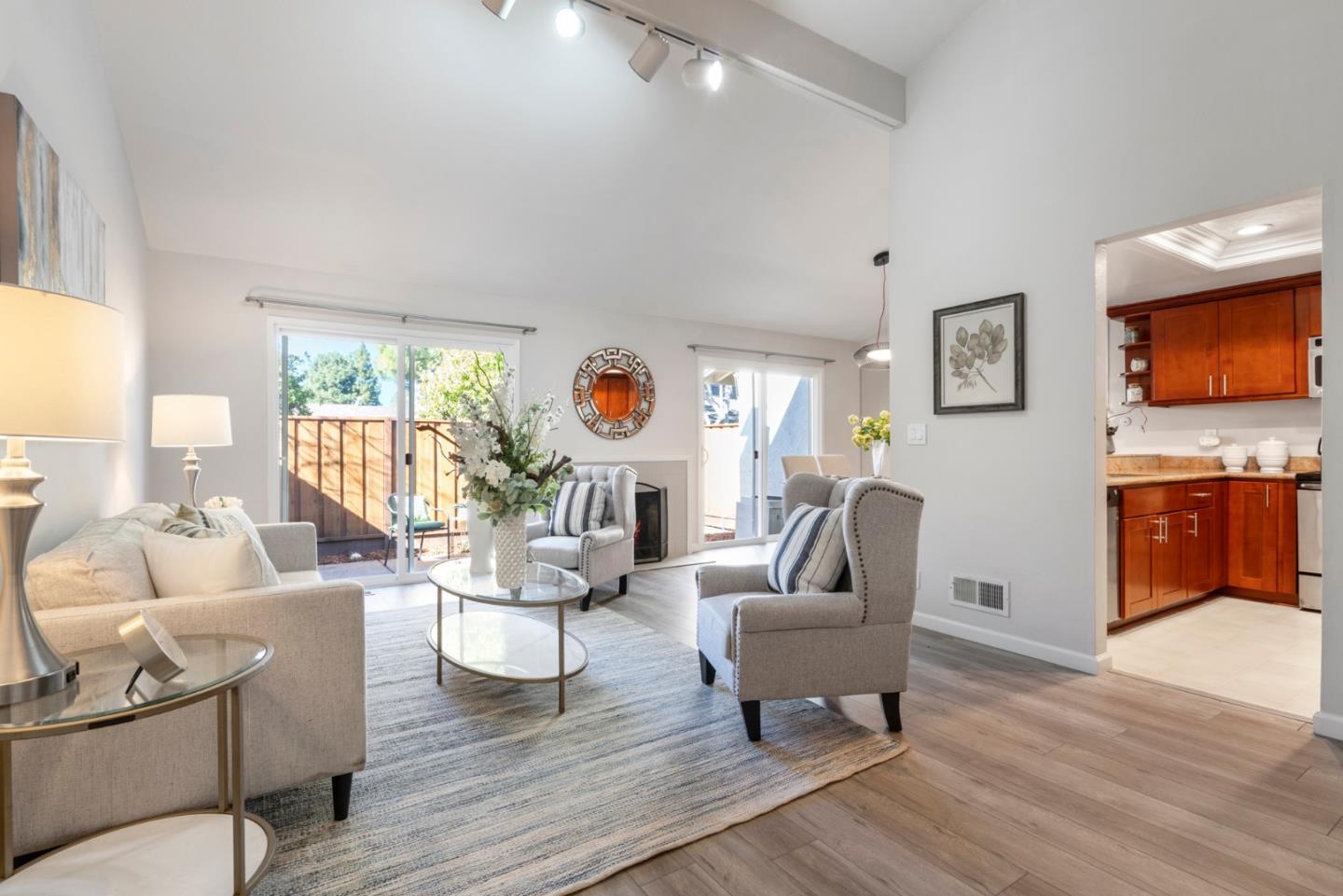 20173 Northcrest Square Cupertino, CA 95014 - Photo 3 of 29 a living room with furniture and a flat screen tv