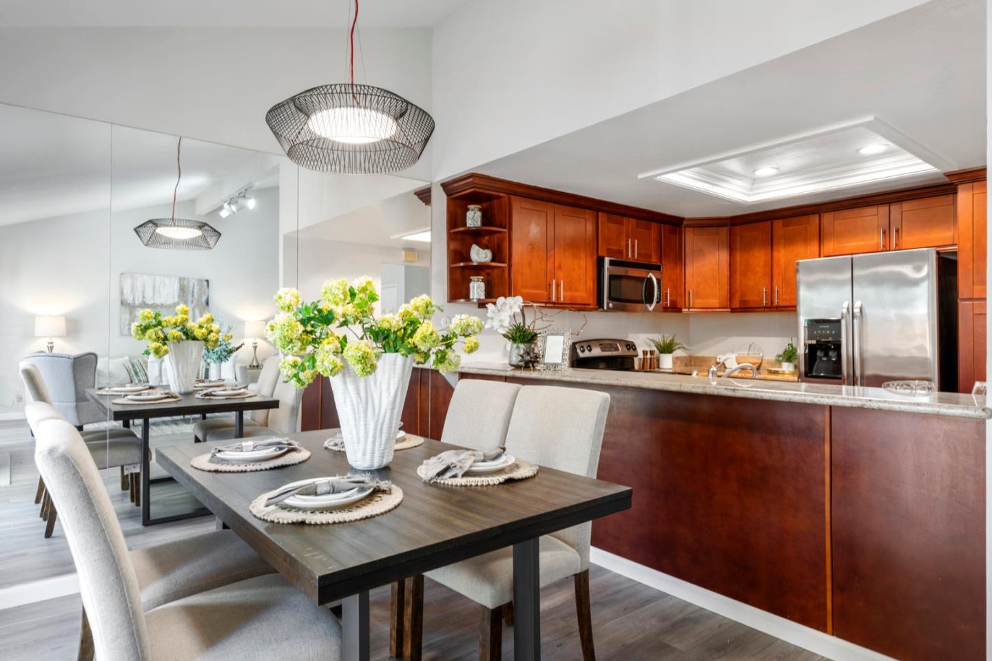 20173 Northcrest Square Cupertino, CA 95014 - Photo 8 of 29 a dining room filled chandelier and wooden floor