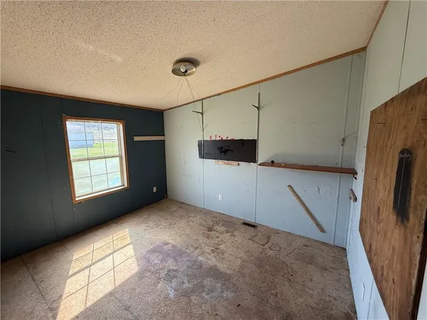 a view of a kitchen with a sink and a refrigerator