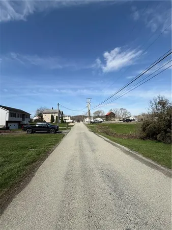 a view of a house with a big yard