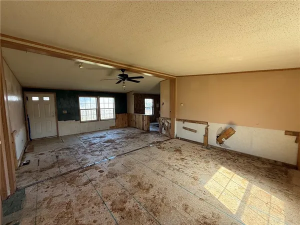 a view of a livingroom with wooden floor and window