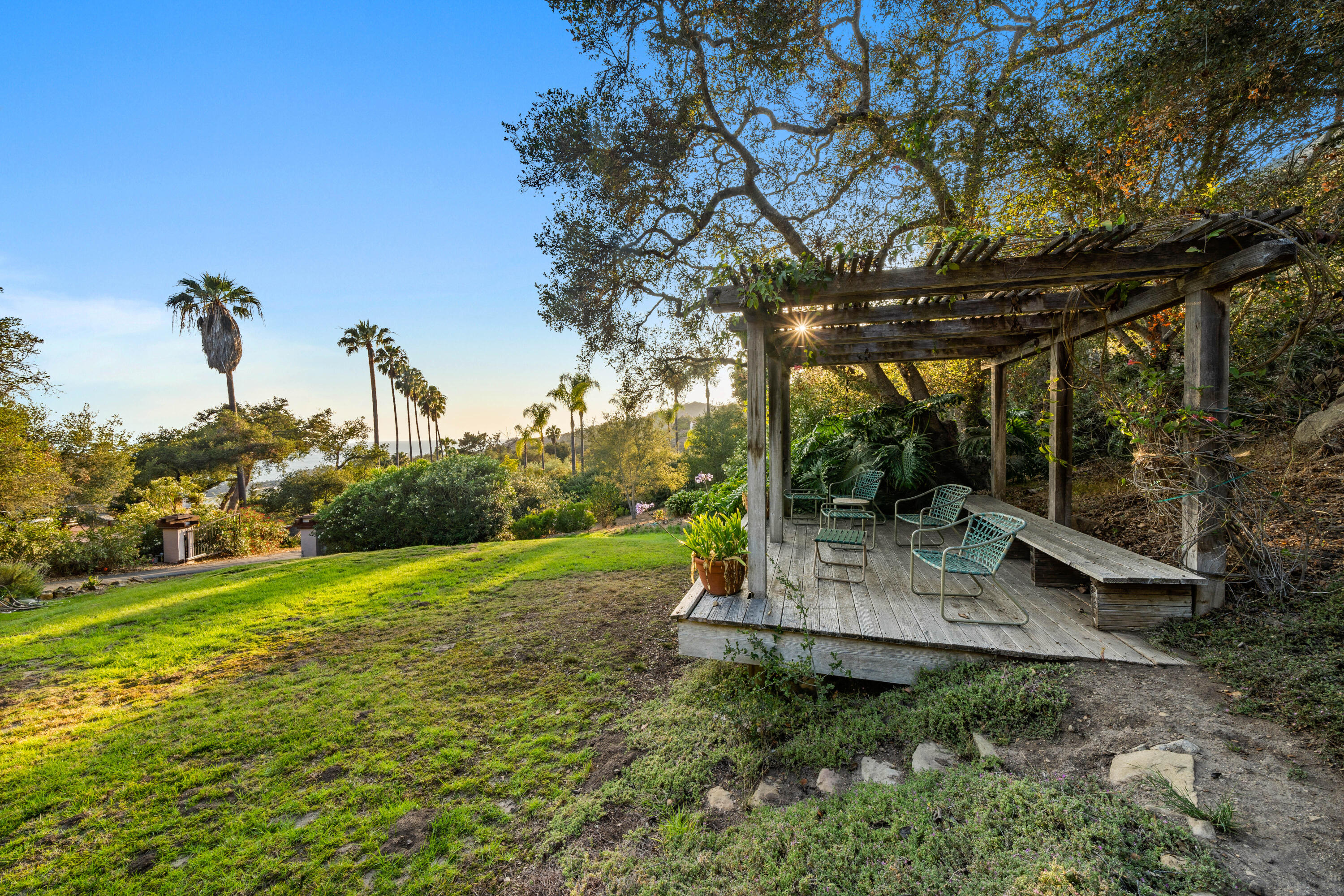 1986 Arriba Street Carpinteria, CA 93013 - Photo 23 of 25 a view of a backyard with large trees