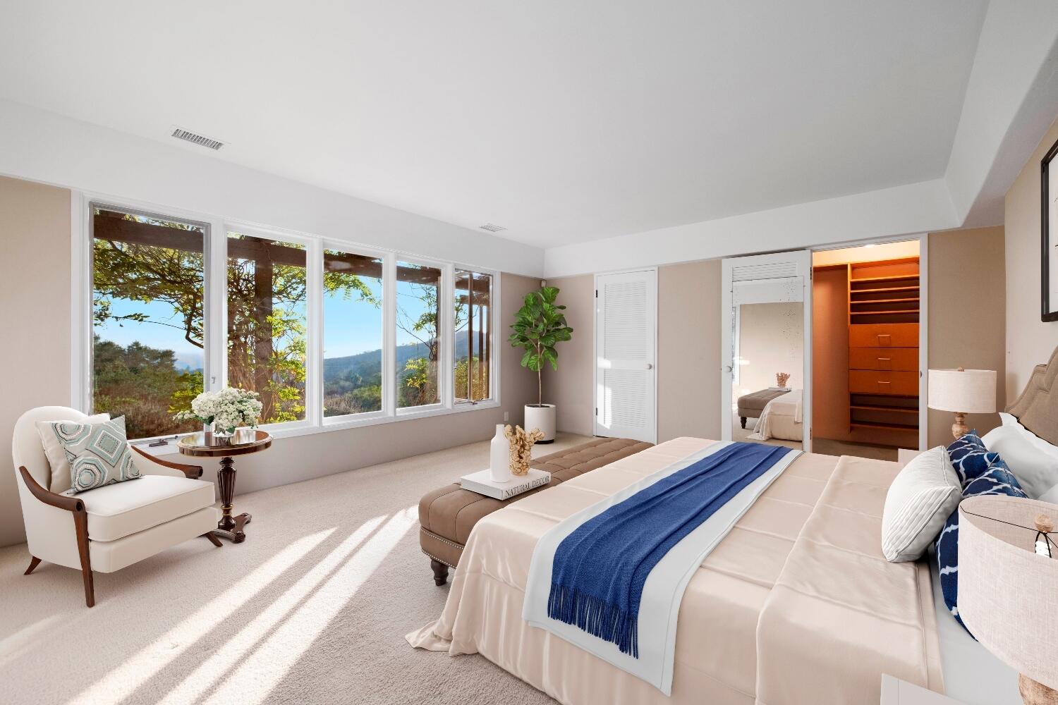 1986 Arriba Street Carpinteria, CA 93013 - Photo 3 of 25 a bedroom with a bed and a couch next to a window