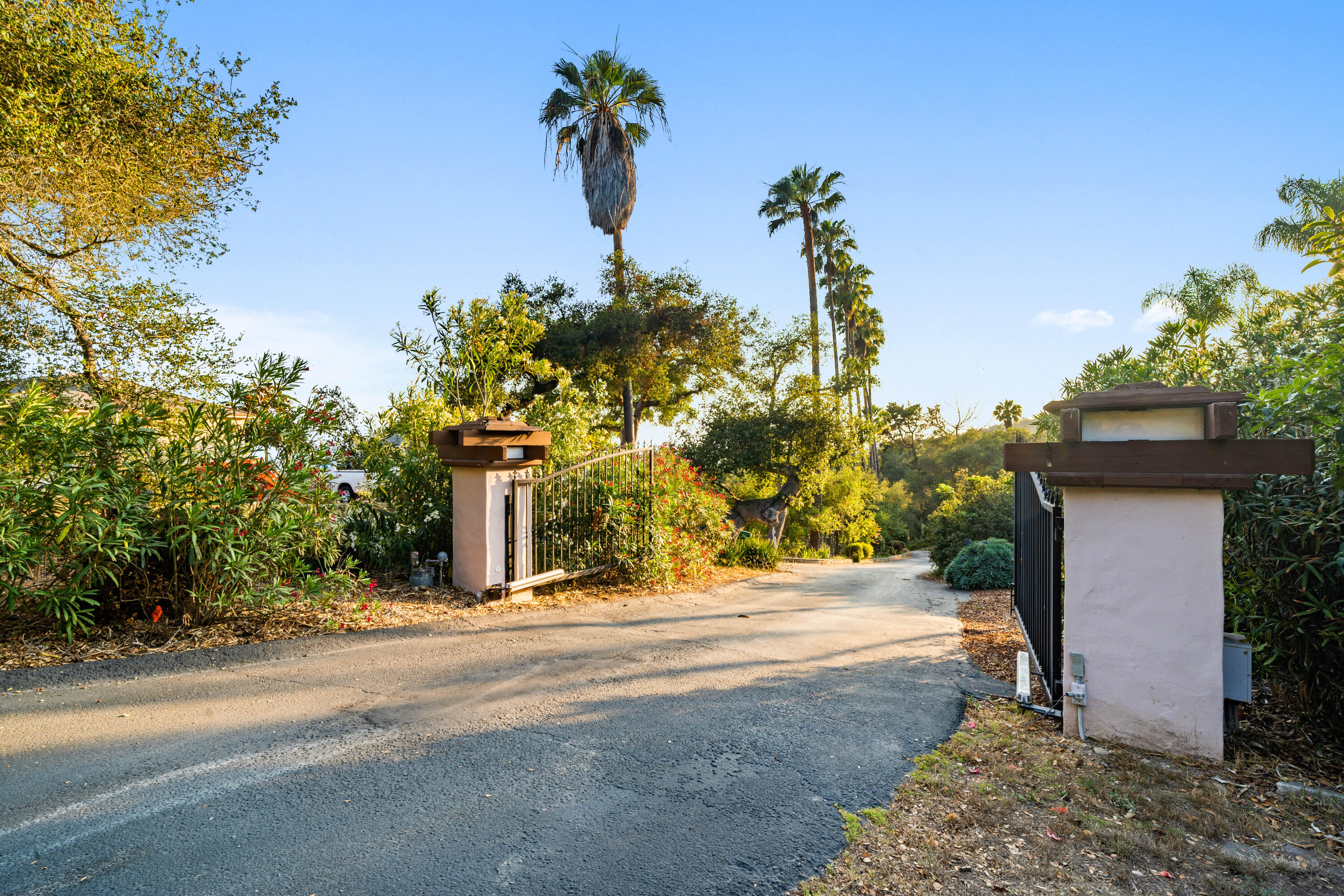 1986 Arriba Street Carpinteria, CA 93013 - Photo 7 of 25 a front view of a house with a yard and garage
