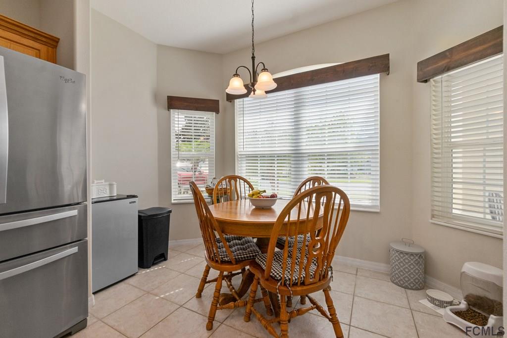 16 Raintree Circle Palm Coast, FL 32164 - Photo 13 of 45 a dining room with furniture and window