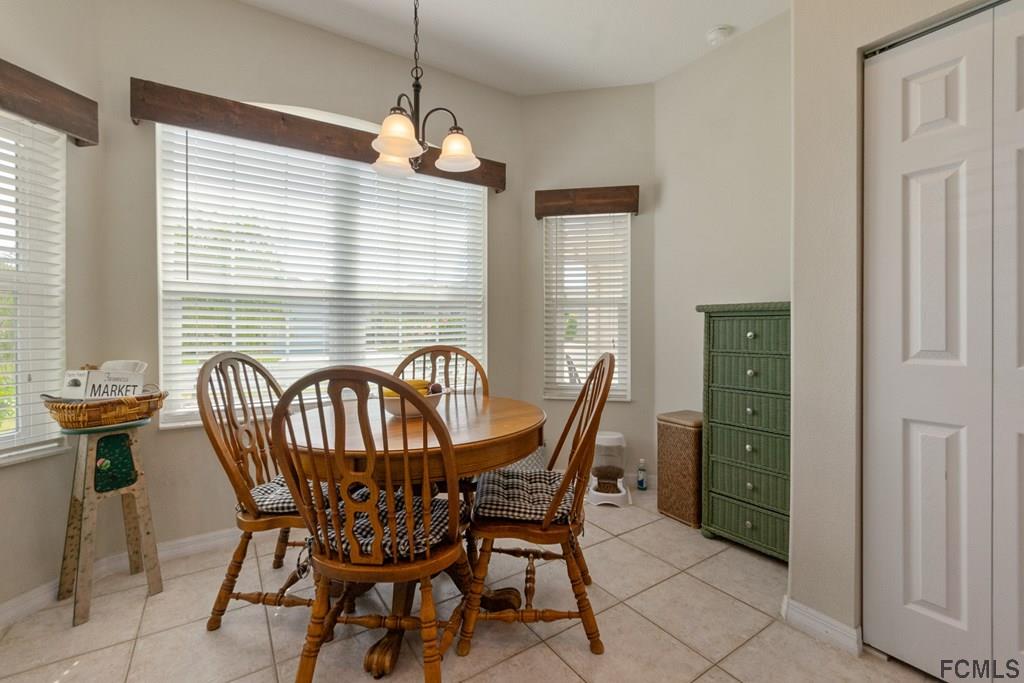 16 Raintree Circle Palm Coast, FL 32164 - Photo 14 of 45 a view of a dining room with furniture window and outside view