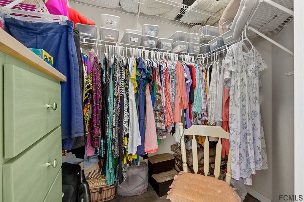 16 Raintree Circle Palm Coast, FL 32164 - Photo 32 of 45 a view of walk in closet with clothes
