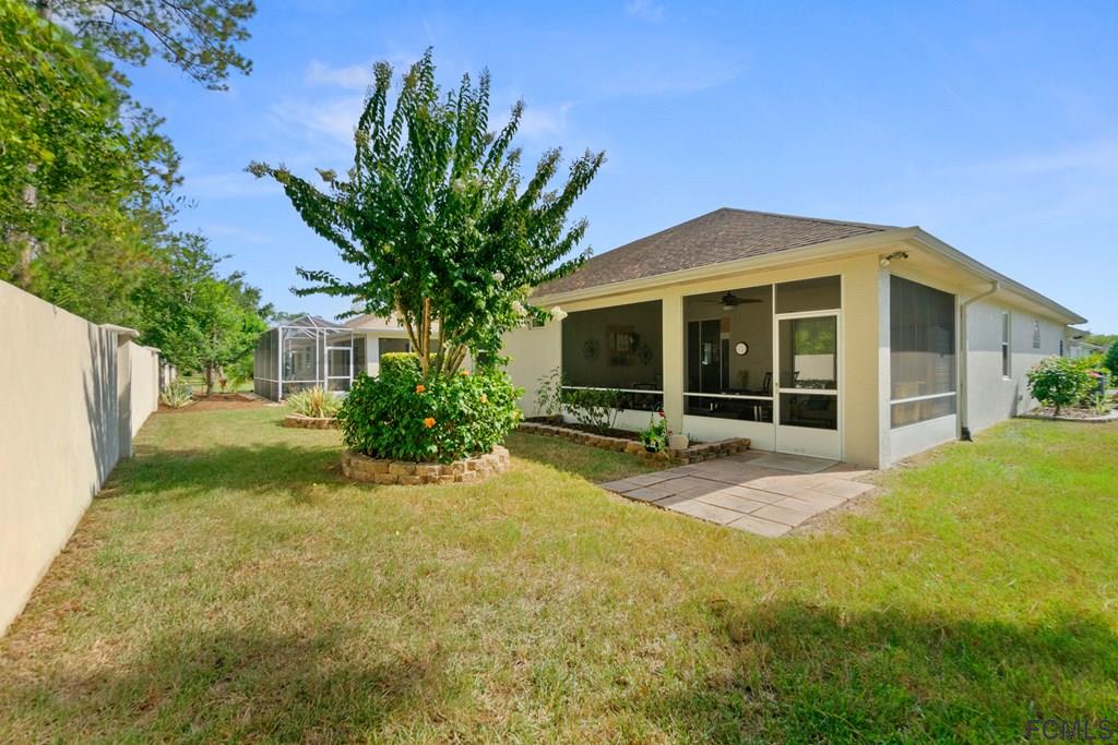 16 Raintree Circle Palm Coast, FL 32164 - Photo 40 of 45 a view of a house with backyard and porch