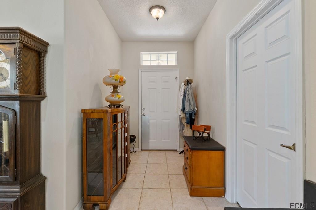 16 Raintree Circle Palm Coast, FL 32164 - Photo 4 of 45 a view of entryway with wooden floor